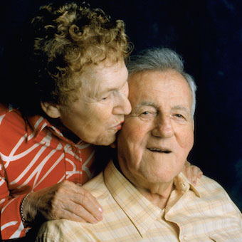 elderly resident couple kissing