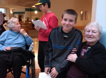 two students and two residents at an intergenerational program