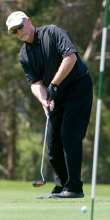 Man teeing into the hole