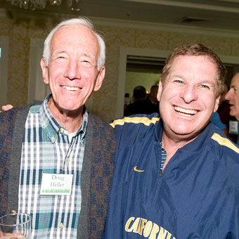 Two men smiling and posing