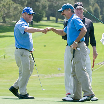 Two males giving a fist-bump