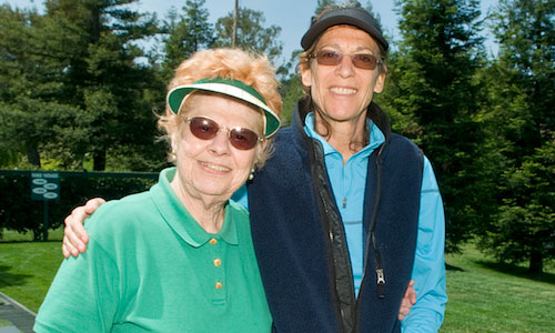 Two women golfing on the fairway