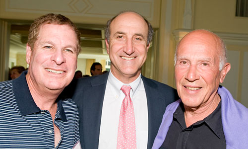 Three males posing at the fundraiser