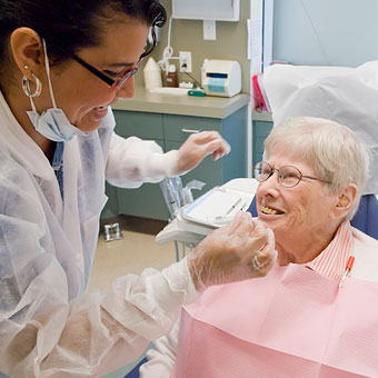 Dentists instructs patient in the Dental Clinic at Jewish Home
