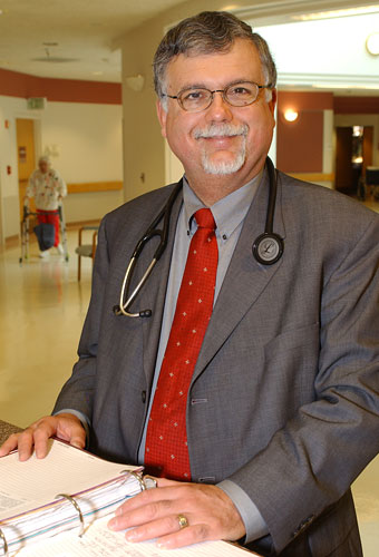 Dr. Hassid making rounds and checking charts